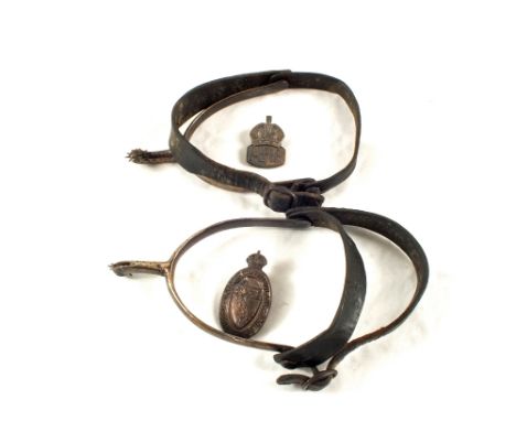A pair of spurs with two badges including a Norfolk Constabulary Special Constable