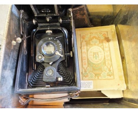 A Corrida 156 plate camera and glass slides including two boxes of colour magic lantern slides