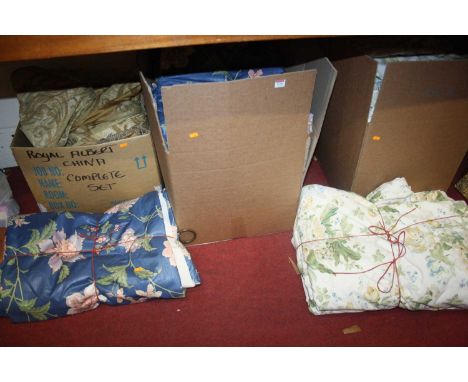 Three boxes of various floral decorated curtains