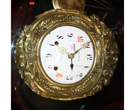 A late 19th century French vineyard clock, having convex white enamel dial surrounded by embossed floral decorated brass surr