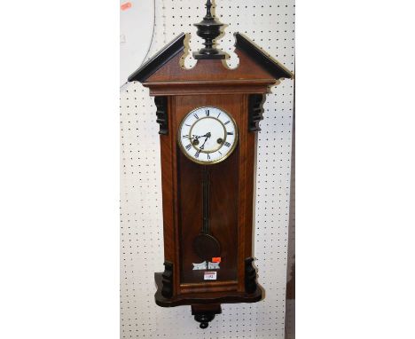 A circa 1900 Vienna walnut cased drop trunk wall clock with pendulum, height 90cm