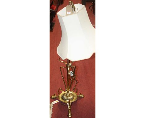 An Art Nouveau brass telescopic standard lamp with shade 