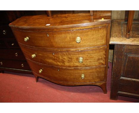 A Regency mahogany bowfront chest of three long graduated drawers, on splayed bracket supports, width 100cm