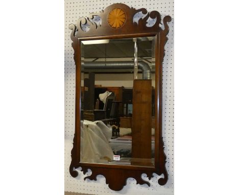 A contemporary mahogany fret carved wall mirror in the Chippendale taste, 90 x 54cm