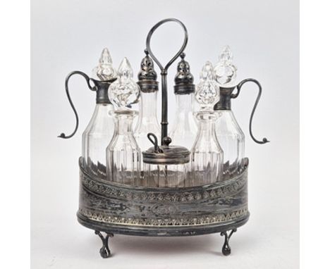 A GEORGIAN SILVER CRUET SET. By Robert Hennell I &amp; David Hennell II, London, 1795. Having seven cut glass bottles four wi