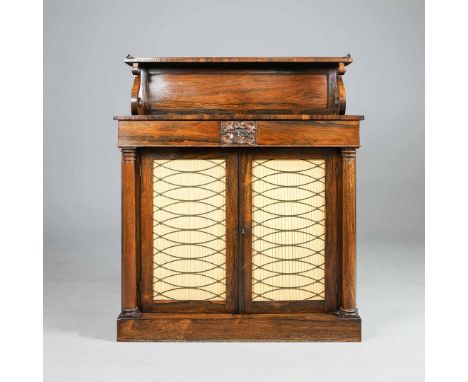 A REGENCY ROSEWOOD CHIFFONIER. Raised back on scroll supports over twin cupboard doors127cm H x 107cm W x 41cm D.