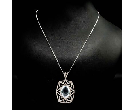 AN AQUAMARINE AND DIAMOND PENDANT NECKLACE. set with a large oval aquamarine with an ornate diamond surround, the aquamarine 