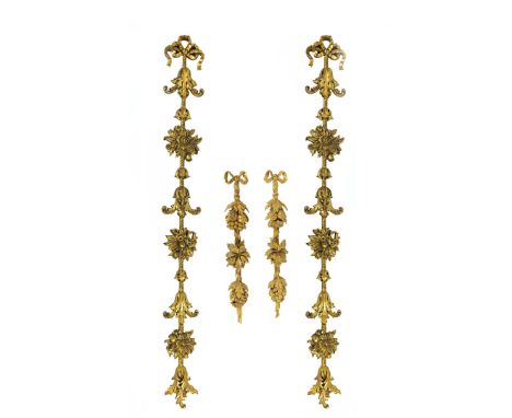 FOUR GILTWOOD WALL MOUNTS. in the Rococo style, in the manner of Thomas Chippendale, comprising one pair measuring 135cm long