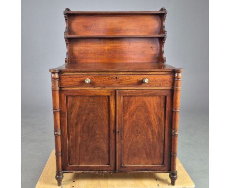 A REGENCY CHIFFONIER. upper shelf above single long drawer and panelled cabinet doors flanked by ribbed columns.  92cmW x 50c
