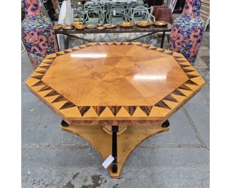 A CONTEMPORARY HAND CRAFTED CENTRE TABLE. in the manner of David Linley, with an octagonal top, parquetry veneered with sycam