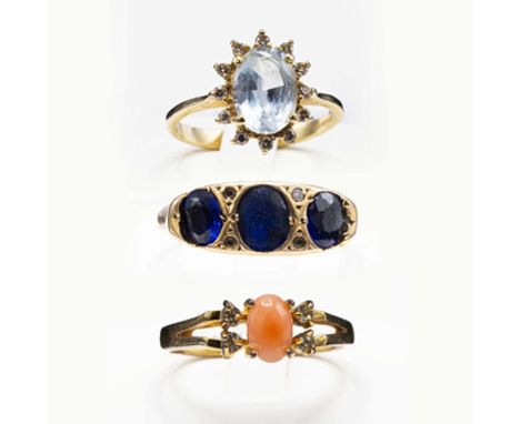 THREE VARIOUS DRESS RINGS. comprising a 9ct gold topaz and diamond dress ring, the oval mixed cut stone surrounded by 12 roun