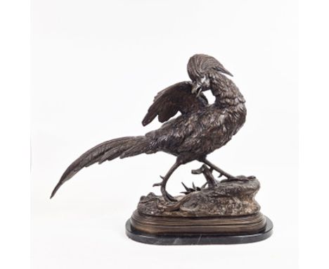 A BRONZE OF AN ANGRY PHEASANT STARTLED BY A LIZARD. mounted on marble base. 55cm H x 70cm L.