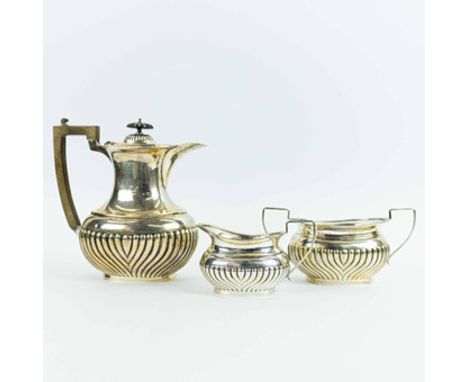A SILVER TEA SET. (3). three piece comprising a teapot, milk jug and sugar bowl, marks for John Henry Wynn, Birmingham, 1938 