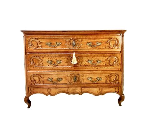 COMMODE. Louis XV, mid 18th century oak, with three long drawers, with key, 97cm H x 133cm W x 58cm D.