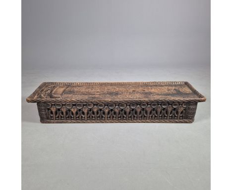 AFRICAN CARVED BED. adorned with carved elephants and lizards. 51cm d x 32cm t x 181cm l.