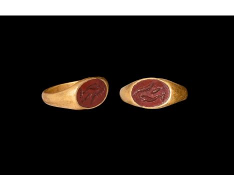 3rd century AD. A jasper elliptical cloison with intaglio dolphin and fishes, set into a later gold finger ring. Cf.Hoey Midd