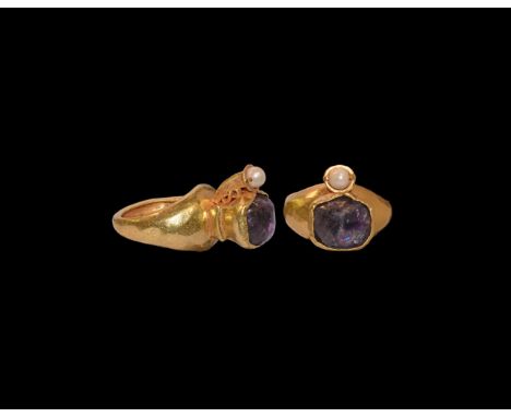 5th-6th century AD. A gold finger ring comprising a C-section hoop with flared shoulders, stepped conical bezel with inset ir