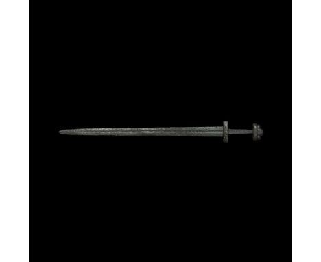 Mid-10th century AD. A hand-forged iron sword with three-lobe pommel and decorated guard; the blade 45mm (1 3/4) wide at the 