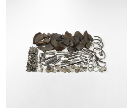 9th-12th century AD. A hack-silver hoard comprising: two complete kolben arm-rings; six arm-ring fragments; a square-section 
