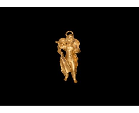 4th-3rd century BC. A gold pendant of Eros, head turned to the left, curly hair to the top and youthful features to face; sma