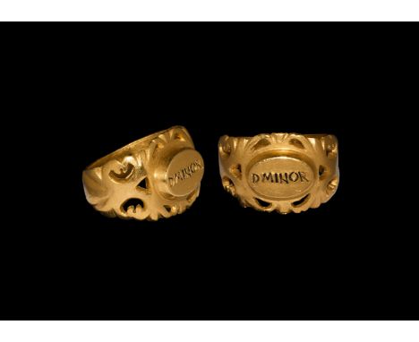 3rd century AD. A gold finger ring comprising a flat-section hoop, flared shoulders with openwork scrolled foliage to the edg