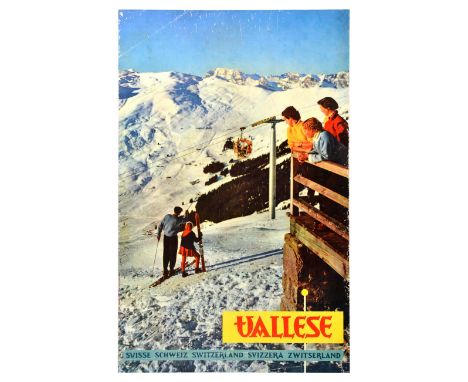 Original vintage winter sport and travel poster Valais in Switzerland, featuring a photograph of a group of people on a balco