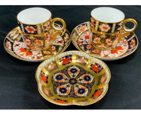A pair of Royal Crown Derby 2451 ‘Old Imari’ coffee cans and saucers, 1128 trinket tray (3) 