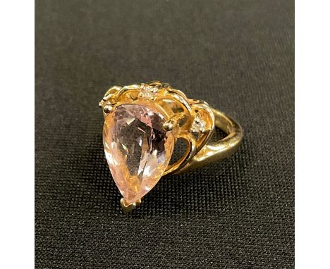 A certified morganite and diamond heart ring, pale pink pear shaped mixed cut morganite 4.60ct, within three stone marquise a