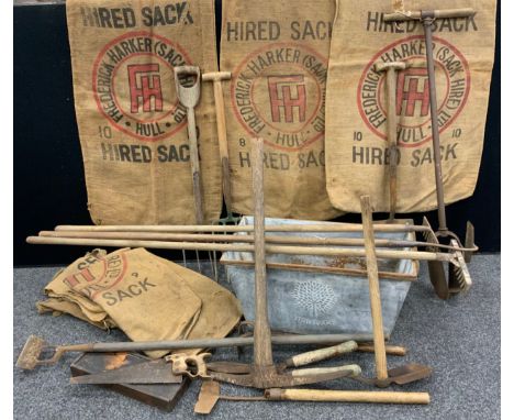 Vintage tools and advertising - four large hessian Sacks, ‘Frederick Harker, Sack Hire’;  mattock, rakes, hoes, bore-hole too