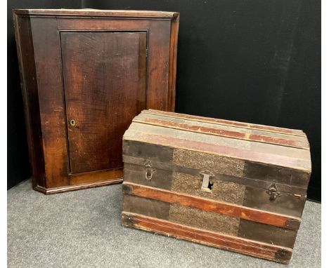 A metal bound dome-top steamer/travelling trunk, 49cm high x 71cm x 40cm;  a 19th century oak corner cupboard (2). 