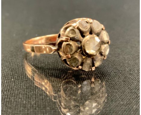 A 19th century and later rose cut diamond cluster ring, set with ten mixed and rose cut diamonds, estimated total diamond wei