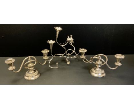 An Art Nouveau silver plated table centre epergne/posy holder;  pair of two branch candlesticks  (3) 