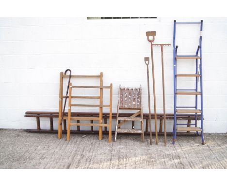 A collection of tools including ladders