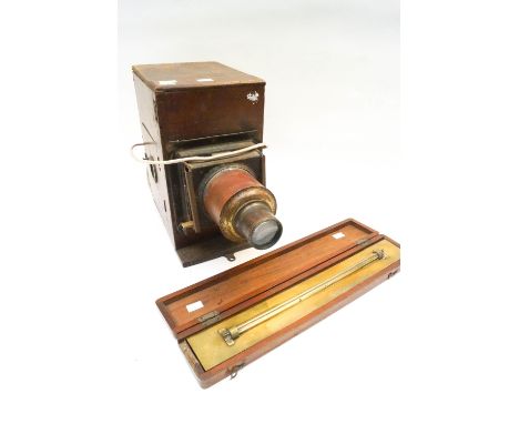 A mahogany magic lantern and a mahogany cased rolling ruler