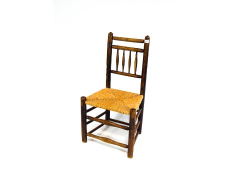 An elm stick back rush seat chair