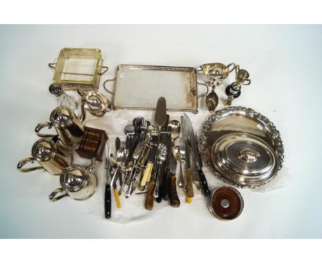 A silver two handled trophy, approximately 240 grams of weighable silver flatware, a silver decanter coaster and assorted pla