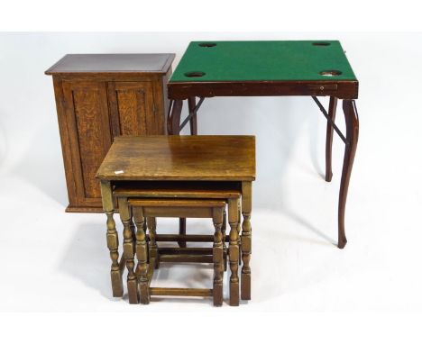 A small cupboard, card table and nest of tables