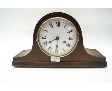 A wood mantel clock