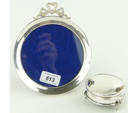 Circular silver photo frame with ribbon mount,
Birmingham 1901, 15cm across and circular silver ring box, 7.5cm across.