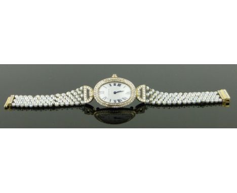 A lady's Cartier Baignoire yellow gold and diamond wristwatch,
mechanical movement, with pearl and diamond strap, case width 