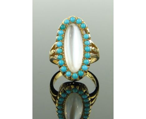 An 18ct gold moonstone and turquoise set ring,
setting height 25mm, size M.