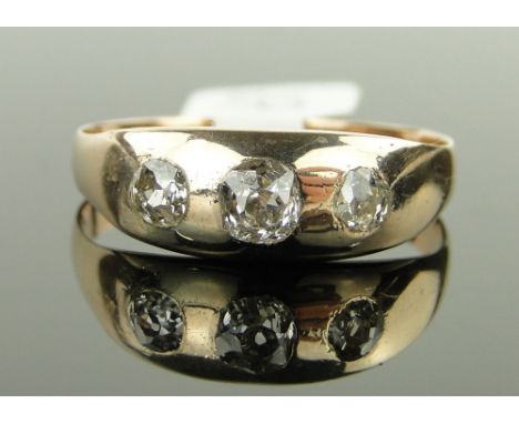 A 3-stone diamond rose-gold gypsy ring,
approx 0.85cts total, size X.