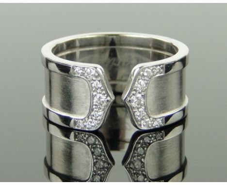 A Cartier 18ct white gold and diamond band ring,
dated 2001, 13.3g, size P.