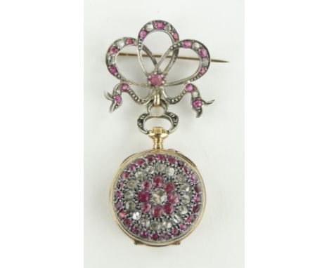 An ornate Swiss ruby and diamond encrusted pendant fob watch circa 1900,
with ribbon design brooch mount, unmarked gold setti