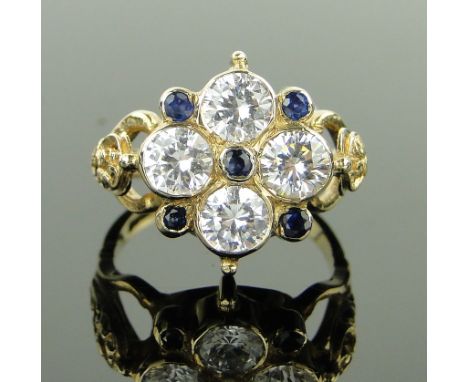 A 9ct gold sapphire and CZ cluster ring,
size M.