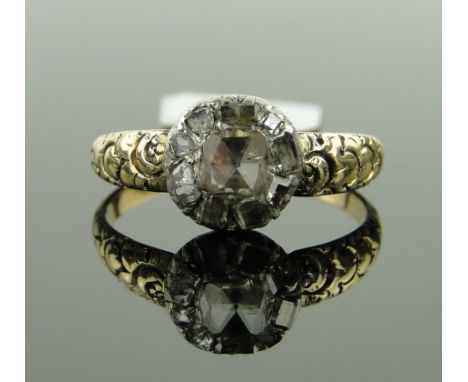 An antique rose-cut diamond cluster ring,
with carved shoulders, setting height 8mm, size O.