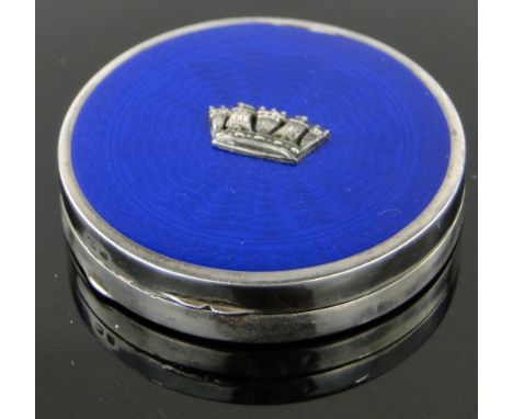 A circular silver and blue enamel compact,
with Cinque Ports crest to the lid, by Jieves, Birmingham 1832, 5cm across.