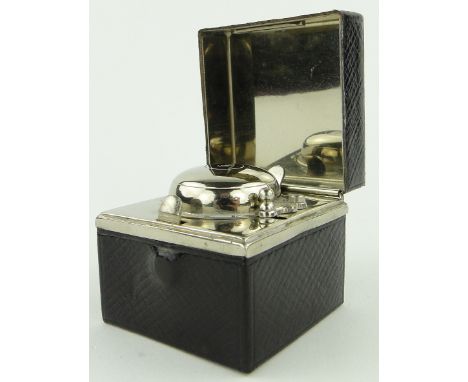 A leather cased silver plated travelling inkwell.
