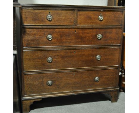 An Antique oak chest of 5 drawers,
with panelled sides raised on bracket feet, width 3'4", depth 20", height 3'5".