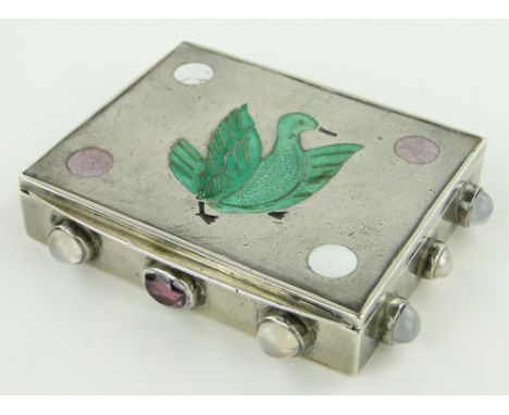 Arts & Crafts unmarked white metal snuff box,
the lid having a coloured enamel bird design, the sides set with cabochon moons